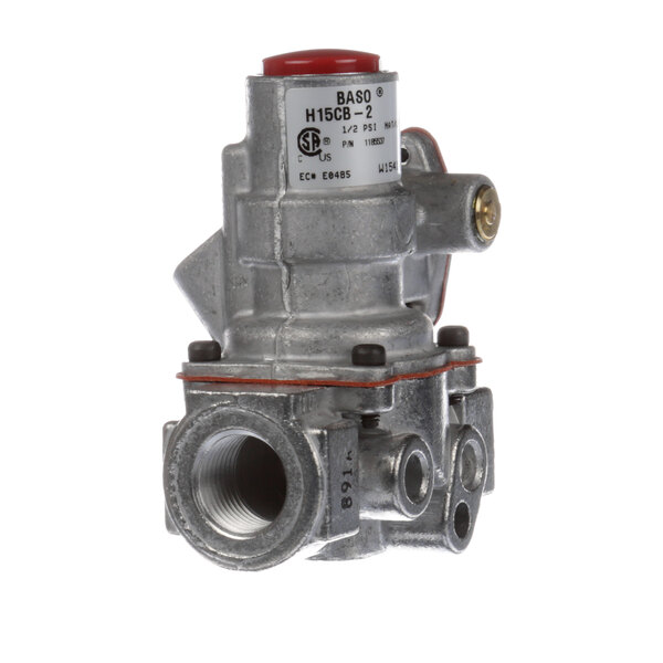 A close-up of a grey metal Southbend safety valve with a red valve.