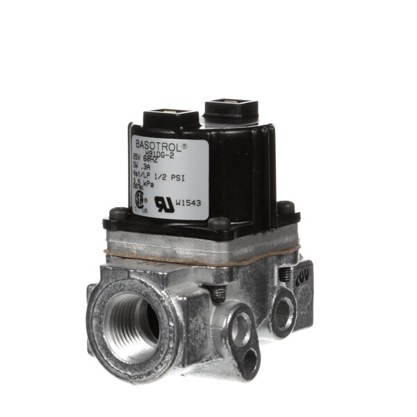 A close-up of a Lang gas control valve with a black cover.