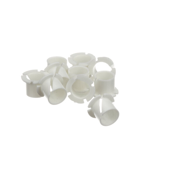 A group of white plastic Antunes pivot arm bearings.