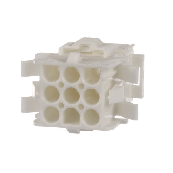 A white plastic block with nine holes.