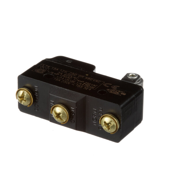 A black electrical device with gold screws.