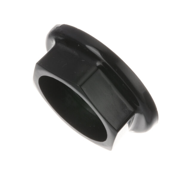 A black plastic nut with a hole in the middle.