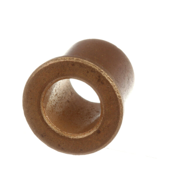 A close-up of a brown Duke bushing with a hole in it.