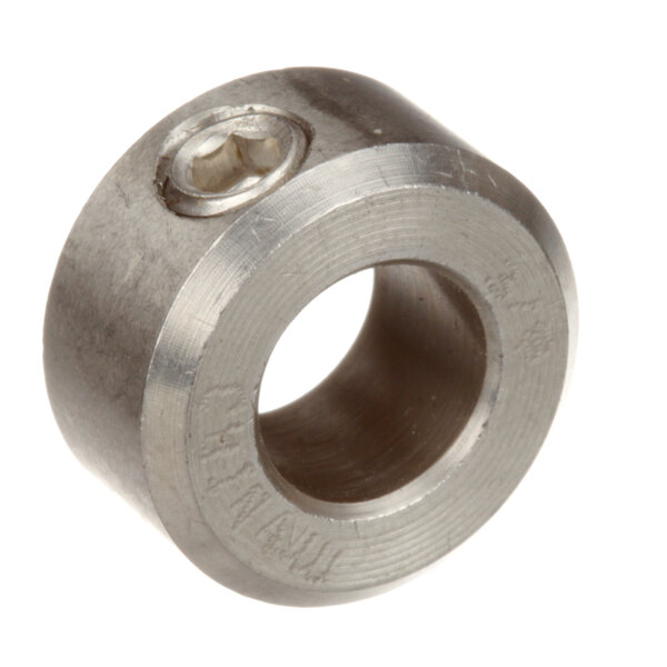 A close-up of a stainless steel threaded nut with a metal ring.