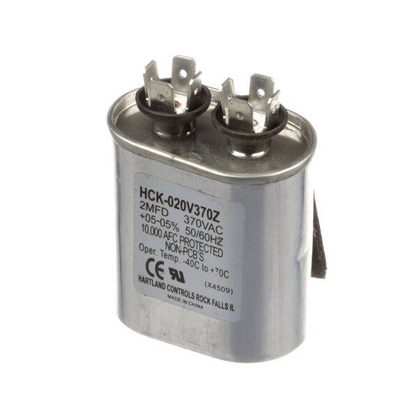 A close-up of a Master-Bilt capacitor with black text on metal.