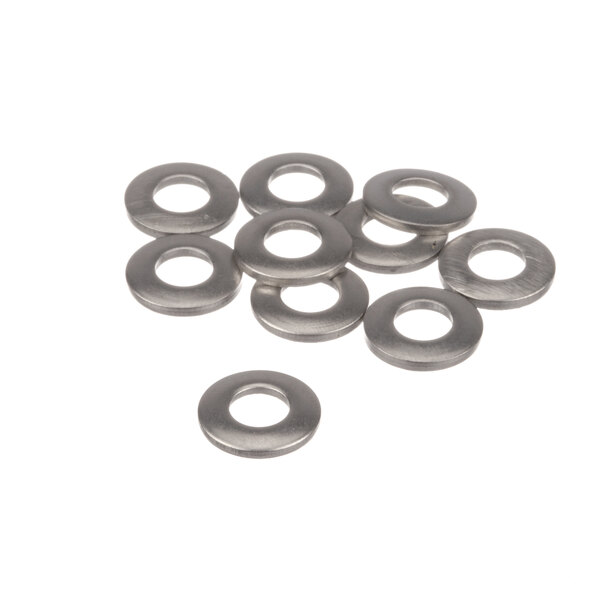 A group of silver metal washers with a hole in the center.