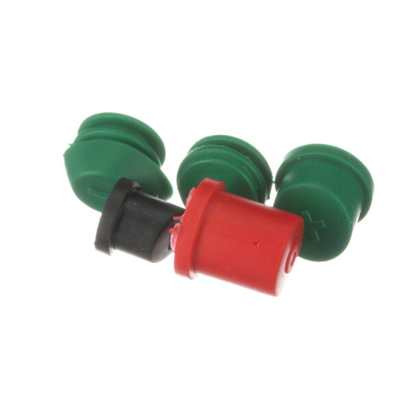 A group of three green and red plastic plugs.