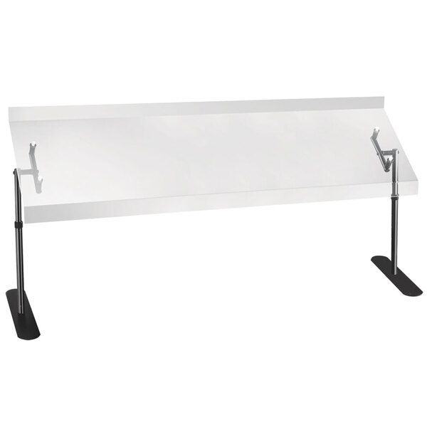 A white rectangular table with a Cal-Mil Portable Acrylic Sneeze Guard with a black metal frame on top.