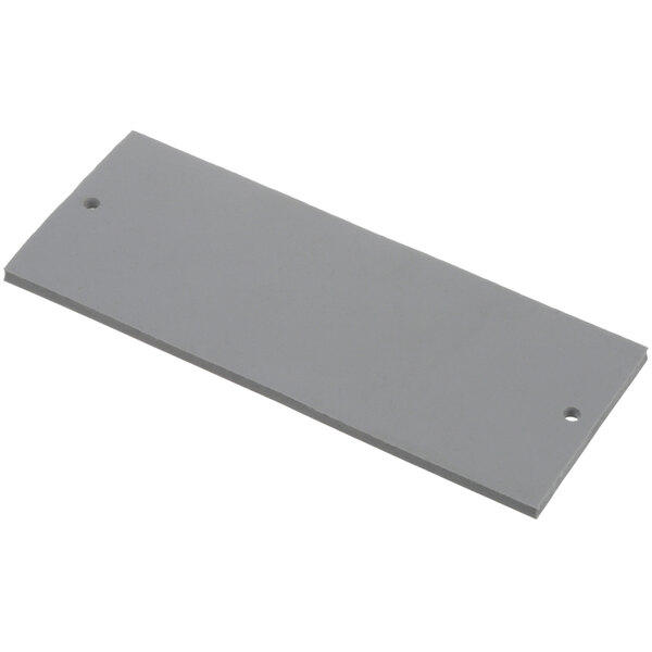 A rectangular piece of grey material with a hole in the middle.
