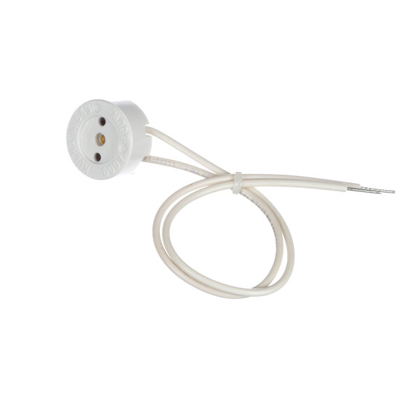 A white round light socket with a wire attached to it.
