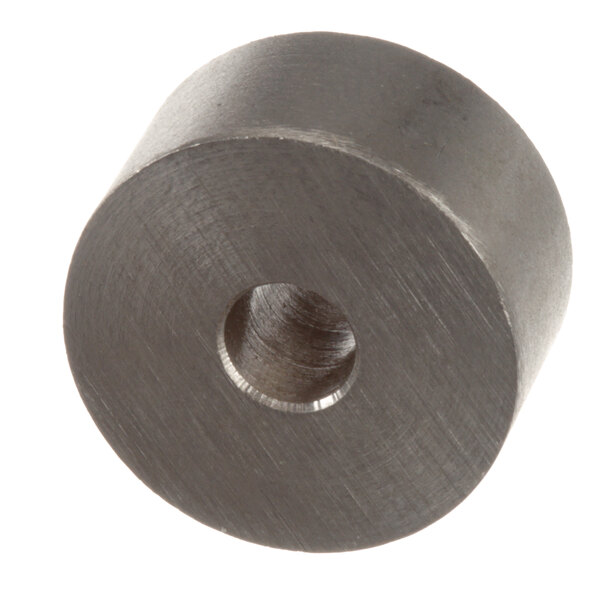 A round metal pawl stop with a hole in it.