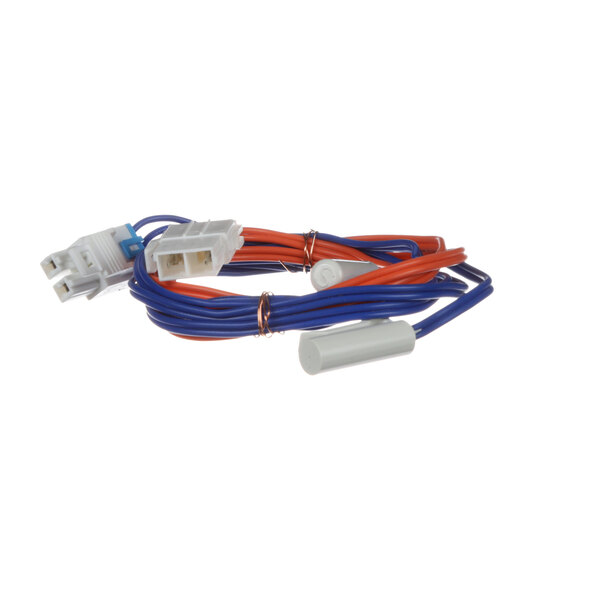 A Norlake defrost sensor with blue and red wires.