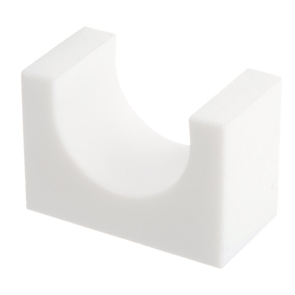 A white rectangular Teflon bearing with a hole in it.