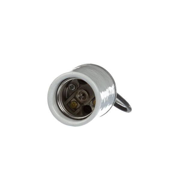A white metal Cres Cor socket with wire leads and a small hole in it.