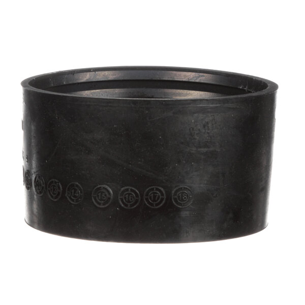 A black rubber ring with a circular pattern.