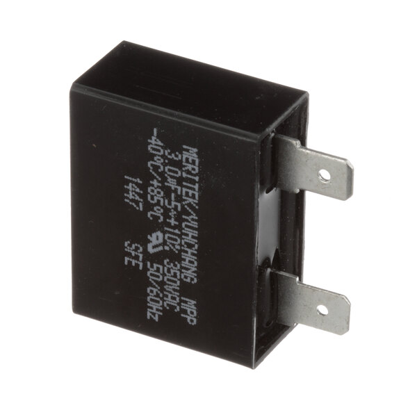A black Groen capacitor coil with white text.