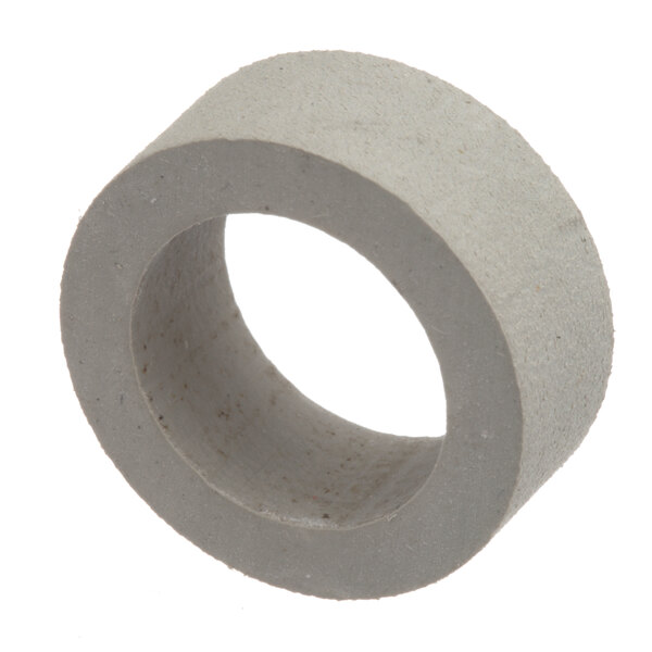 A close-up of a grey Groen gasket with a hole in it.