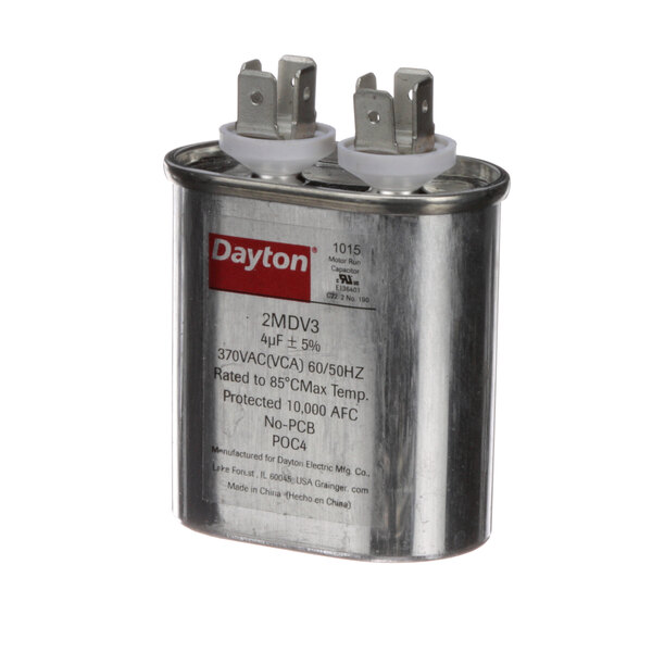 A Baxter metal capacitor with white caps.