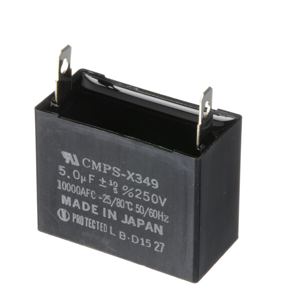 A black rectangular capacitor with white text.