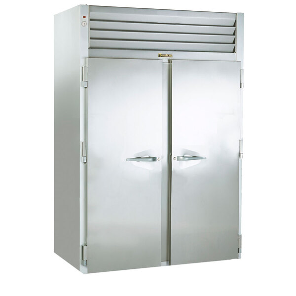 A Traulsen stainless steel double door refrigerator with doors open.