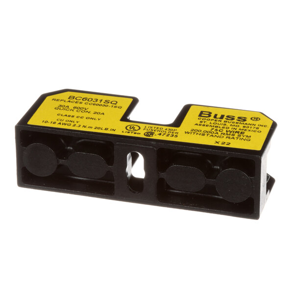 A Groen black and yellow electrical fuse block with two wires.