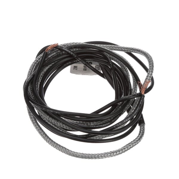 A black and white wire with a black and white cable attached to a Norlake Drain Line Heater.