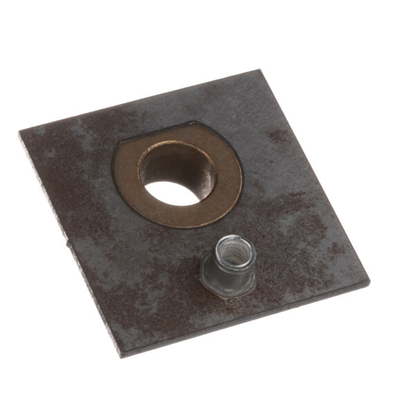A square metal plate with a hole in it.