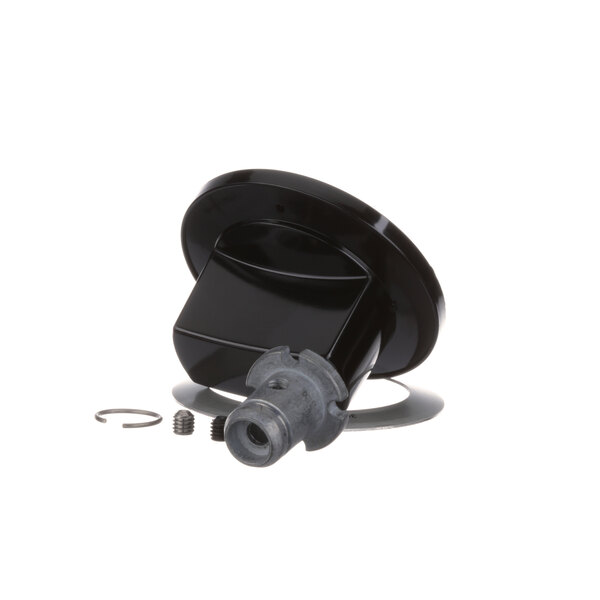 A black plastic Garland range knob with a metal ring on it.