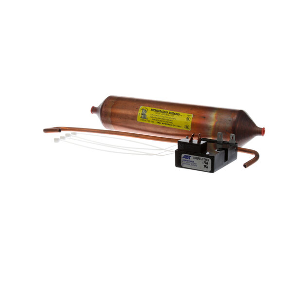 A copper tube with a yellow label and wires.