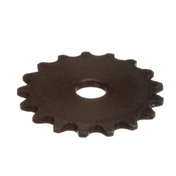 A close-up of a black gear sprocket with a hole in it.