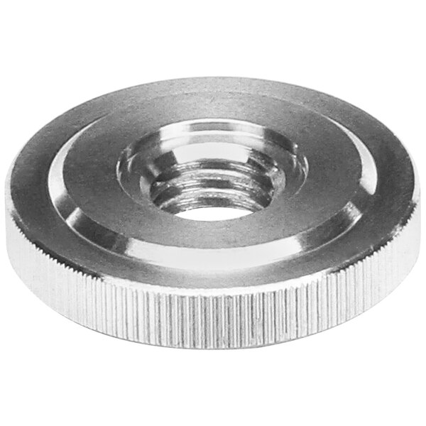 A stainless steel Champion spac.nut with a threaded hole.