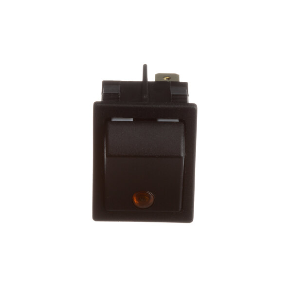 A close-up of a black Fagor Commercial rocker switch with an orange light.