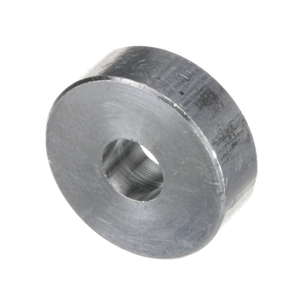 A round metal BKI spacer with a hole in it.