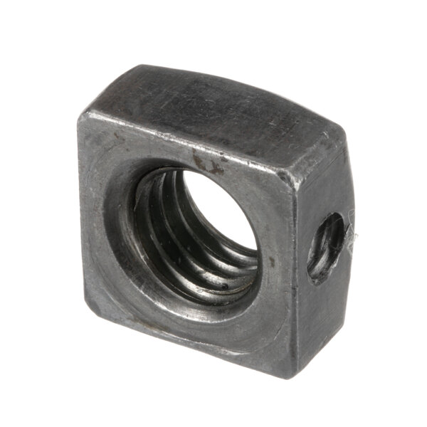 A close-up of a Cleveland square metal nut with a hole in it.
