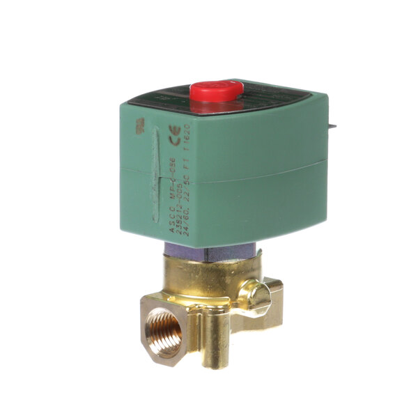 A close-up of a green and gold Groen solenoid valve with a red button.