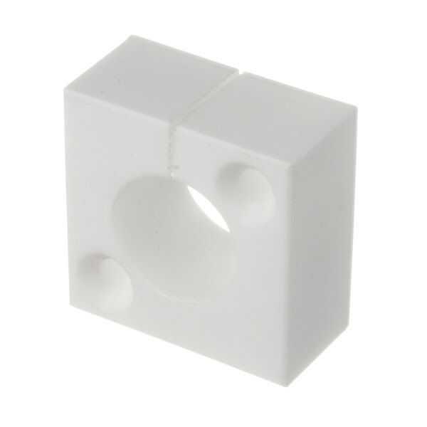 A white block with holes.