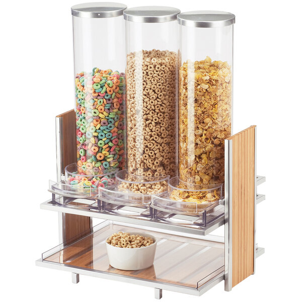 A Cal-Mil triple cereal dispenser filled with cereal.