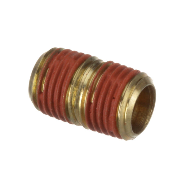 A close-up of a red and gold Cleveland brass nipple.