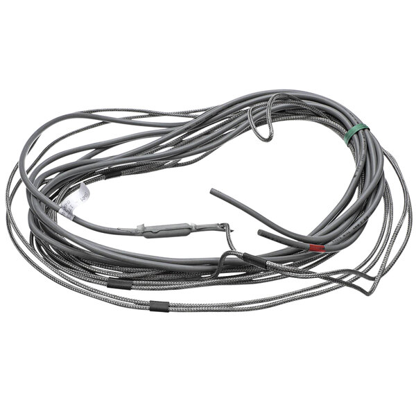A coiled grey Norlake drain line heater cable with a connector.