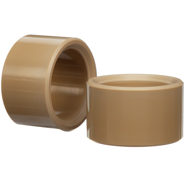 A close-up of a beige plastic cup with a brown lid.