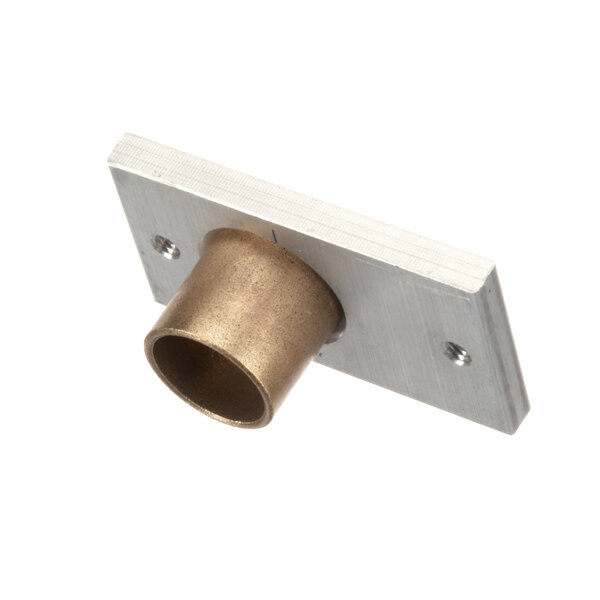 A metal bearing block with a brass tube.