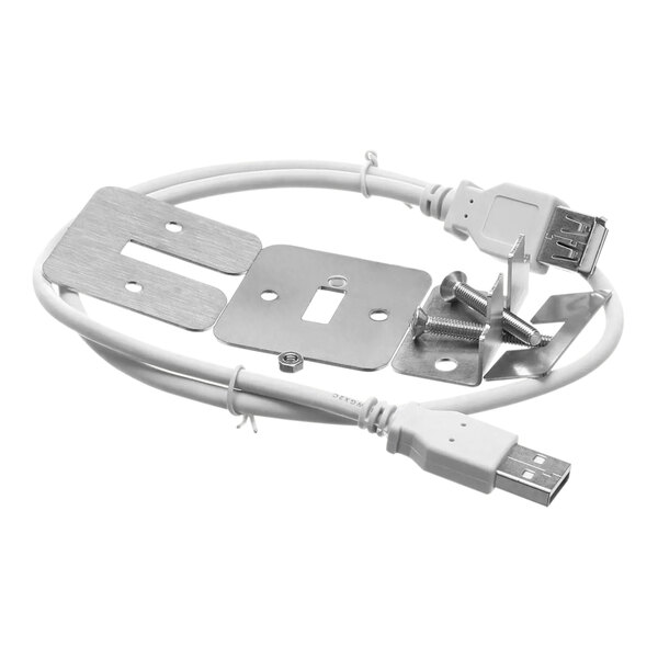 A white cable with a metal connector plugged into a metal plate with screws.