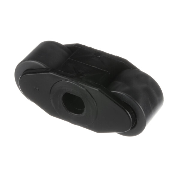 A black plastic Jackson roller with a hole.