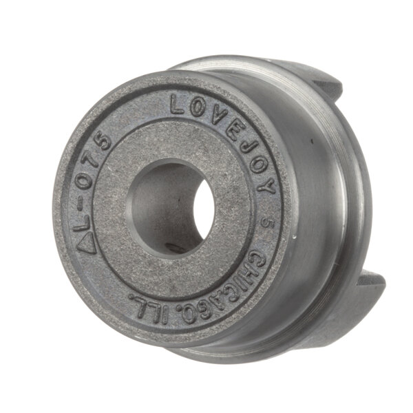 A Cleveland steel coupling hub with a round metal piece and a hole.