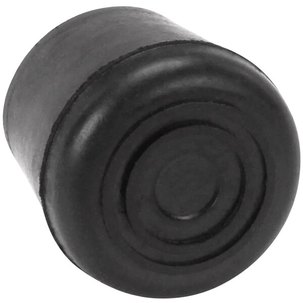A black rubber crutch tip with a circular pattern on the bottom.