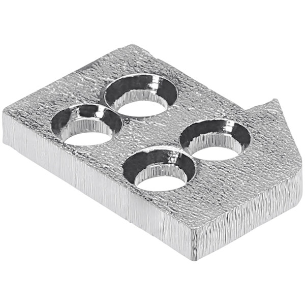 A silver metal plate with four holes.
