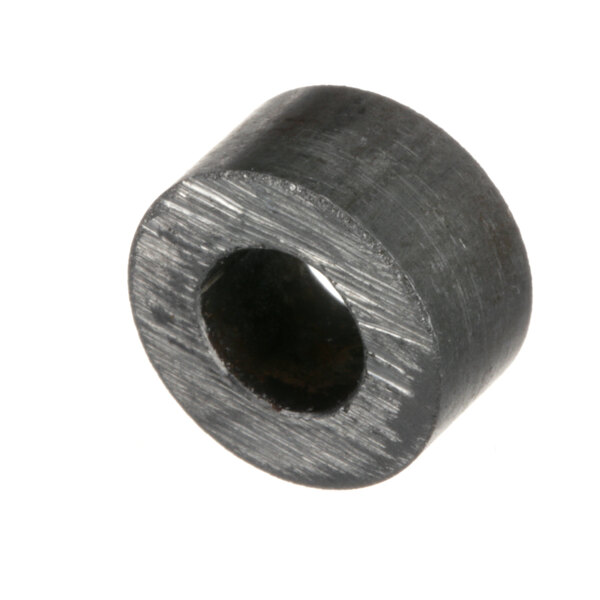 A round black metal spacer with a hole in the middle.