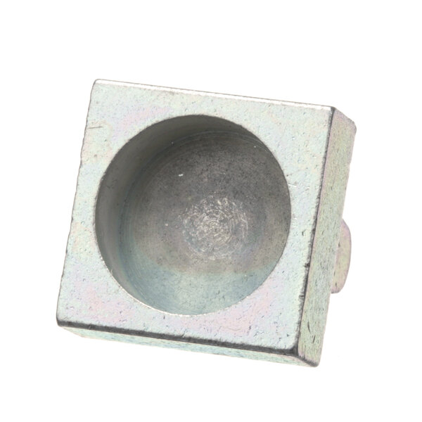 A square metal Vulcan door catch with a round center.