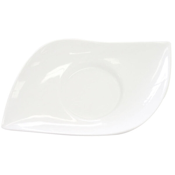 A white plate with a curved edge with a small bowl on it.