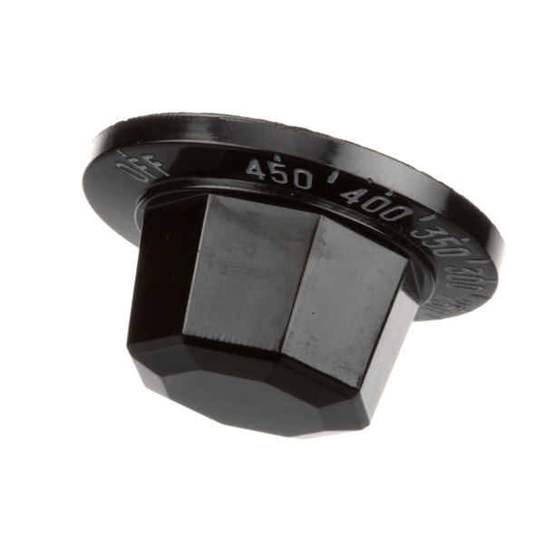 A close-up of a black BKI plastic knob with a hexagonal shape.